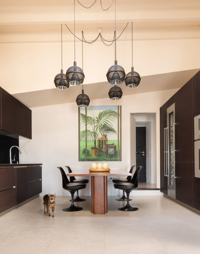 The dramatic wood and marble-clad kitchen of a luxury Ibiza townhouse